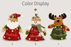 Detailed view of Christmas gift bags featuring Santa, snowman, and reindeer embroidery