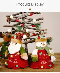 Detail of Santa and Snowman felt ornaments with Merry Christmas embroidery and plush balls