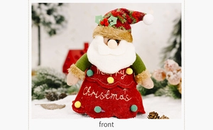 Detail of Santa Claus fabric doll with Merry Christmas embroidery and red felt dress