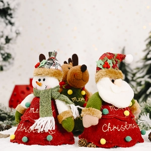 Christmas tree shaped candy bags featuring Santa Claus, Snowman and Reindeer plush designs