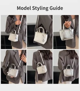 Detail shots of the stylish bucket bag with silver charm and removable strap on model