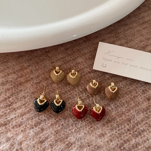 Set of four heart-shaped enamel stud earrings in red, black, coffee, and khaki finishes