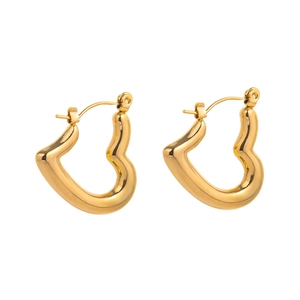 Detailed view of polished heart-shaped gold earrings with secure lever-back closure