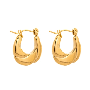 Detailed view of chunky golden croissant hoop earrings in polished stainless steel texture