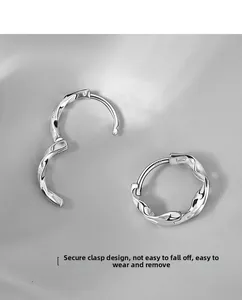 Macro view of S925 sterling silver hoop earrings with twisted rope texture and clasp
