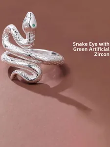 Macro shot of s925 silver snake ring showing scale texture and green zircon eyes