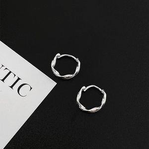Minimalist S925 sterling silver twisted wave hoop earrings with polished finish