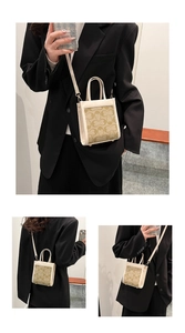 Detail of checkered mini tote bag with adjustable shoulder strap and top handles