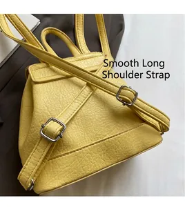 Detail of yellow lychee grain PU leather backpack with adjustable silver metal buckle strap