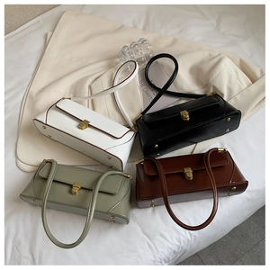Collection of vintage baguette bags in white, black, green and brown with gold hardware