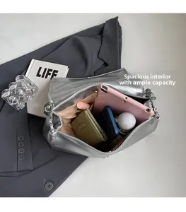 Spacious interior of silver metallic tote bag showing tablet and daily essentials
