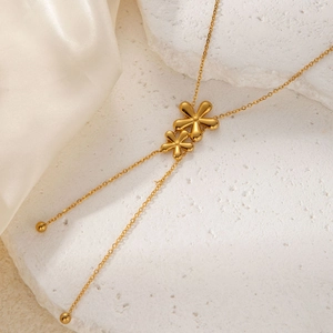 Exquisite gold floral bow pendant necklace with double flower design on stone base