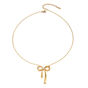 Detail view of 18K gold bow necklace featuring a white pearl and textured hammered finish