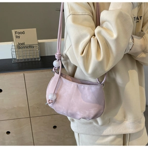 Detail of pink soft PU cloud bag with beaded strap decoration and matte finish