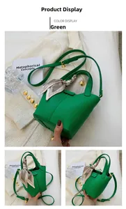 Detail of green bucket bag with lychee texture and silk scarf wrapped around handle