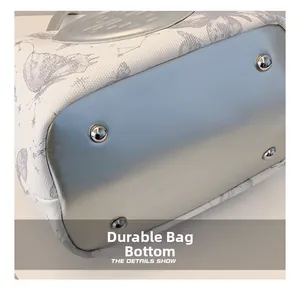 Macro view of wear-resistant tote bag bottom with silver finish and metal studs