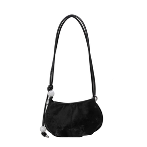 Minimalist black crescent shoulder bag with white marble beads on slim leather strap
