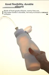 Flexible food-grade silicone water bottle being squeezed to show durable material