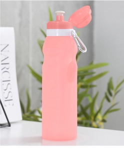 Detail of pink silicone folding water bottle with metal carabiner for outdoors