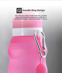 Detail view of pink silicone bottle featuring a durable metal carabiner and integrated carry strap