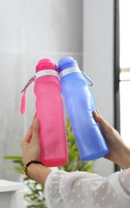 Detail of pink and blue collapsible silicone sports bottles with metal carabiner clips