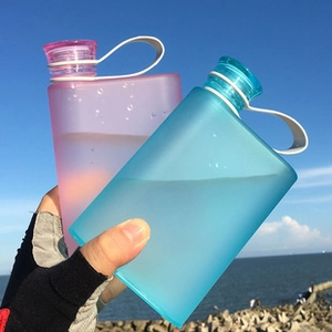 Flat portable memo water bottles in frosted pink and blue with convenient carrying straps
