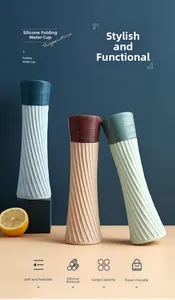 Close-up of collapsible silicone water bottles with textured diamond pattern in three colors