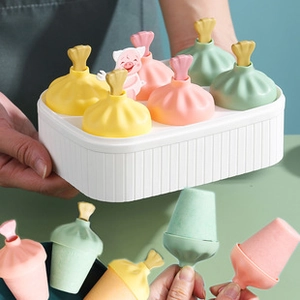 Detailed view of 6-cavity silicone popsicle mold with cute bone handles and pastel lids