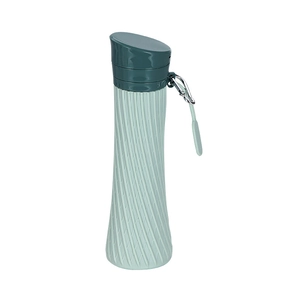 Collapsible silicone sports bottle in mint green with non-slip texture and carabiner clip
