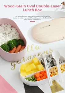 Detail view of double-layer oval lunch box with wooden lid and reusable utensils