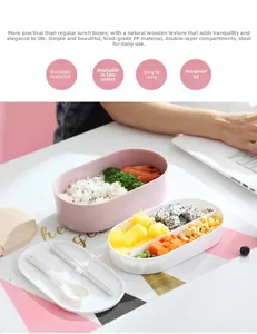Close-up of pink and white stackable lunch box set with cutlery and double-layer divider