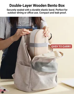 Putting a minimalist oval lunch box with wood lid and strap into a canvas backpack