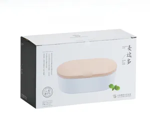 Detailed view of white 800ml double-layer bento box with wood-textured lid and packaging