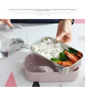 Detail showing hot water being poured into a pink 304 stainless steel bento lunch box