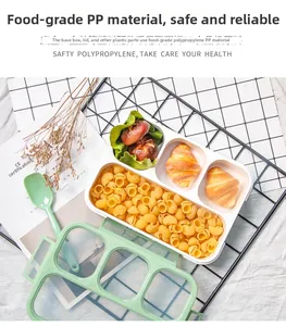 Three-compartment bento box with green seal and utensils for healthy meal prep