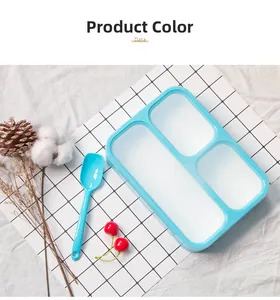 Close-up of three-compartment sky blue lunch box with a matching spoon and secure seal