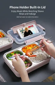 Detail of pink bento box lid featuring a built-in foldable smartphone stand and phone