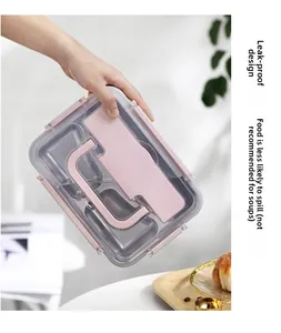 Pink leakproof lunch box with compartments being tilted to show the secure lid seal