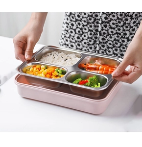 Macro shot of 4-compartment stainless steel lunch box showing food separation layout