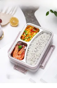 Divided stainless steel lunch box with pink shell and leak-proof lid for meals