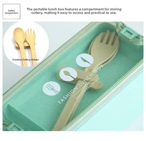 Detail view of the mint green wheat straw lunch box with a built-in cutlery compartment