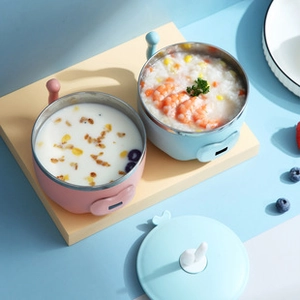 Detail of bunny-shaped thermal baby bowls with stainless steel interior in pink and blue