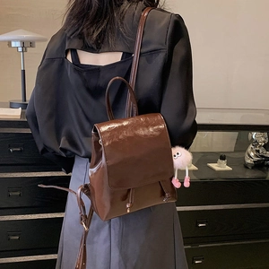 Brown vintage glossy PU leather backpack for women with cute pink plush ball charm