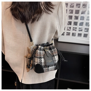 Plaid bucket bag with black leather drawstring and cute brown bunny charm for women