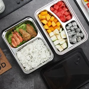 Top view of 304 stainless steel lunch box with compartments for rice, prawns, and fruit