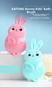 Close-up of rabbit-shaped silicone bath brushes in pink and blue with finger slots