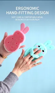 Detail of rabbit-shaped silicone cleaning brush with finger ring handle in two colors