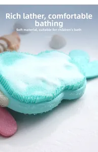 Close-up of soft mint green rabbit silicone bath brush with rich foaming bubbles