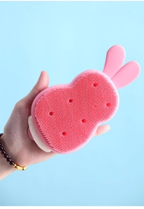 Pink rabbit-shaped silicone cleaning brush with fine bristles and inner sponge core