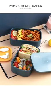 Detail view of large capacity blue bento box with yellow lid and white utensils